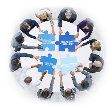 A diverse group of people sitting around a table