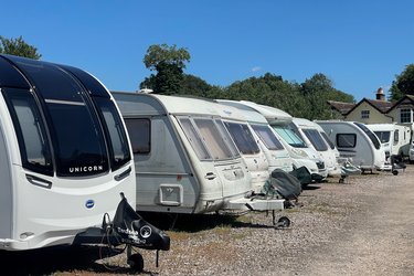 caravans lined up on gravel at our caravan storage site