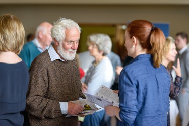 People talking at a community event