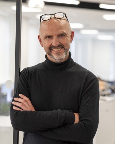 A headshot of Graham Fisher