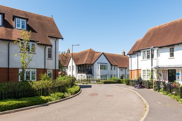 White houses with brown roofs.