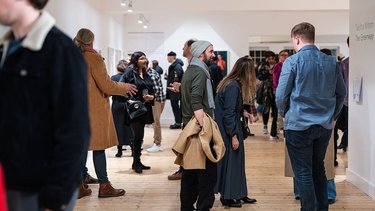 Lots of people view a new exhibition opening at Broadway Gallery