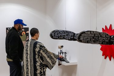 People look at the art at Broadway Gallery